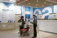 AHA Market Scan Look for CVS to Expand in Chronic Care Management. A CVS HealthHUB Store worker helps a customer.